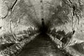 Deep sewage tunnel with poinson flowing Royalty Free Stock Photo