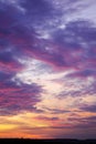 Deep sky above horizon. Bright sunset with clouds