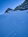 deep snow descent with the skis from the mutteristock. North descent with avalanche risk. Beautiful slalom tracks. Royalty Free Stock Photo