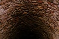 Deep stone well, old dungeon, concept of ancient castle communications, underground prison, history of human settlements