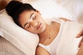 Deep in a sweet dreamland. a young woman sleeping in bed at home. Royalty Free Stock Photo