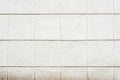 Deep texture of a white painted porous stone on the facade of the building. Finishing the facade of the building into Royalty Free Stock Photo