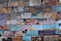 Multicoloured stone brick background of porphyry and sandstone