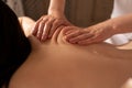 Deep tissue massage close-up. Woman having massage of body in the spa salon. Charming lighting. beauty treatment Royalty Free Stock Photo