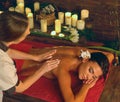 Deep tissue massage treatment in Ayurveda of woman in spa salon. Royalty Free Stock Photo