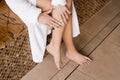 Deep vein thrombosis and varicose of woman. Girl touching her legs and looking at veins. Sclerotherapy procedure at