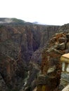 a deep view of the mountain valley is at the black rim Canyon Gunnison national Park in Colorado