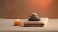 Deep warming vibes of spa, beauty treatment and wellness background with massage pebbles, candle and towels Royalty Free Stock Photo