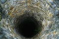 Deep water well in the town, inside. Slovakia Royalty Free Stock Photo