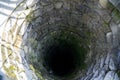 Deep water well in the town, inside. Slovakia Royalty Free Stock Photo