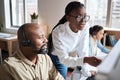 A deeper understanding connects us. a businessman and businesswoman using a headset and computer while working in a Royalty Free Stock Photo