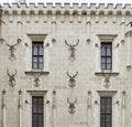 Deer antlers on the facade of the walls in the courtyard of the hunting lodge Frauenberg in the Czech Republic