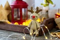 Deer crocheted on a wooden background. The concept of a cozy, magical Christmas and New Year