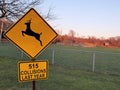 Deer crossing sign with vehicle collision stats Royalty Free Stock Photo