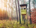 Deer hunting tower in woods Royalty Free Stock Photo