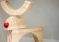 Deer made of wood in a minimalist style. Red nose