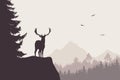 Deer with stags standing at the top of rock with mountains and f