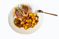 Deer steak Wellington, potato and sauce on white plate, isolated on white background