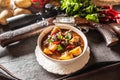 Deer stew in a bowl hunting weapon as a decoration Royalty Free Stock Photo