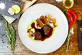 Deer tenderloin. Truffle-potato puree, porcini mushrooms, baked leek and carrot, juniper bread, port wine sauce Royalty Free Stock Photo