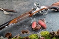 Deer or venison steak with antique long gun and ingredients like sea salt and pepper, food background for restaurant or hunting lo Royalty Free Stock Photo