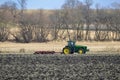 Deere 8420 tractor pulling a White 445 disk chisel plow