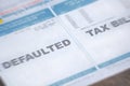 Defaulted Tax Bill with Blur Royalty Free Stock Photo