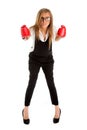 Defeated loser woman - business concept with businesswoman wearing boxing gloves standing in full body looking hopeless.