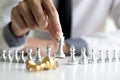 Defeating business competitors, young men playing chess and winning rivals flatly, success of financial investors Royalty Free Stock Photo