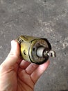 Defect worn out solenoid part disassembled from old gasoline starter motor engine