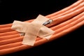 Data cable with band aid to symbol a workaround. Royalty Free Stock Photo