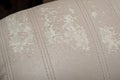 Defects on a white leather sofa. Damaged to leather furniture.