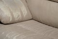 Defects on a white leather sofa. Damaged to leather furniture.