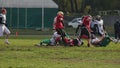 Defence team trying to intercept ball, players running to the end zone, sport