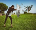 Woman defends herself from the attack of mosquitoes with a shield