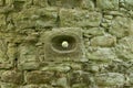 Defense hole for arrows in scone castle Royalty Free Stock Photo