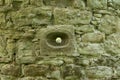 Defense hole for arrows in scone castle Royalty Free Stock Photo