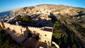Defense Walls of Ancient fortress Alcazaba of Almeria, Spain - aerial shot including panoramic view of the Almeria city Royalty Free Stock Photo