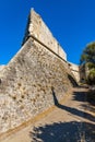Defense walls and towers of medieval fortress Fort Carre castle in Antibes resort city onshore Mediterranean Sea in France Royalty Free Stock Photo