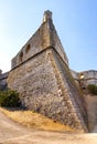 Defense walls and towers of medieval fortress Fort Carre castle in Antibes resort city onshore Mediterranean Sea in France Royalty Free Stock Photo