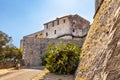 Defense walls and towers of medieval fortress Fort Carre castle in Antibes resort city onshore Mediterranean Sea in France Royalty Free Stock Photo