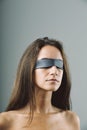 Defenseless woman, blindfolded, silent