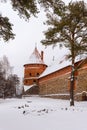 Defensive stone walls of historical Trakai castle covered with snow, Lithuania. Winter landscape Royalty Free Stock Photo