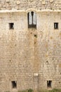 Wall of the castle of torroella de montgri with a window in the middle