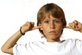 defiant child fingers in ear Royalty Free Stock Photo