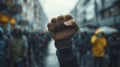 Defiant Fist Raised at Rainy Protest March