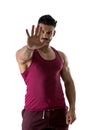 Defiant stern muscular man making a Halt or Stop gesture Royalty Free Stock Photo
