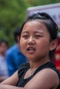 Defiant young woman looks into the camera, Shanghai, China