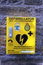 Defibrillator life saving equipment yellow box Royalty Free Stock Photo