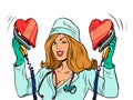 Defibrillator. The nurse resuscitates the heart. Love romance, valentine symbol